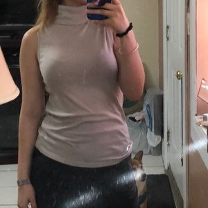 Sleeveless turtleneck cream top